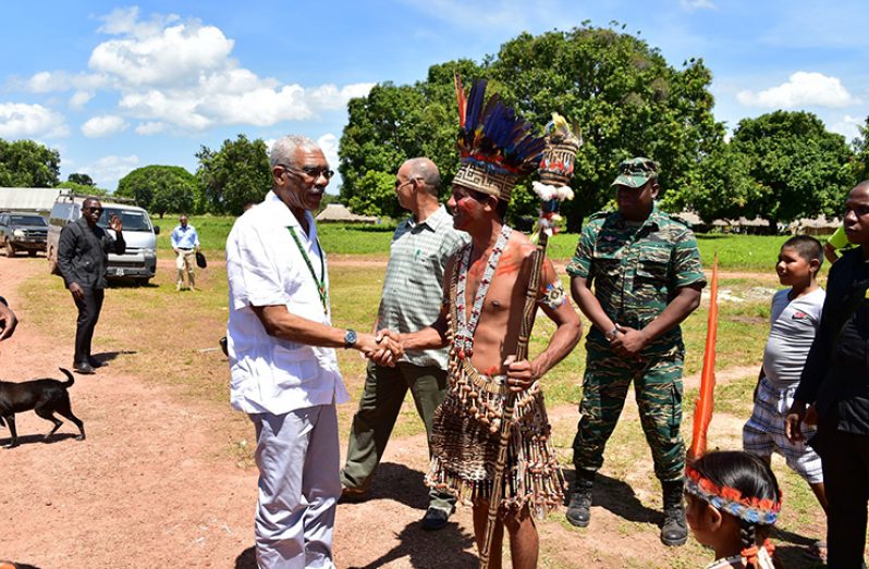 President David Granger greets Toshao of Shulinab Village Nicholas Fredericks, upon arrival at the Heritage Day celebration