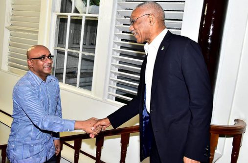 President David Granger greets Opposition Leader Bharrat Jagdeo on his arrival at State House on March 1