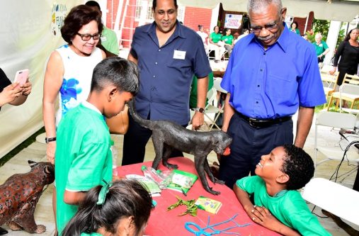 President David Granger, First Lady Mrs. Sandra Granger and Iwokrama’s Chief Executive Officer (CEO), Mr. Dane Gobin looking at some of the artwork created by the children