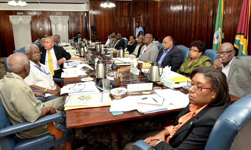 President David Granger (fifth from right) and Members of his Cabinet being briefed by the Chief Executive Officer of the Guyana Sugar Corporation (GuySuCo) Mr. Errol Hanoman, at Cabinet meeting today.