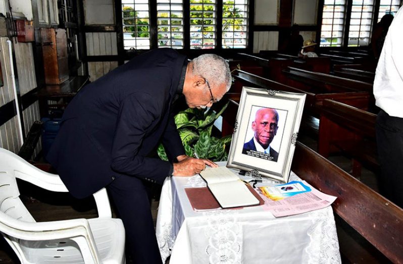 President David Granger signing the Book of Condolence for the late Mr. Noel Gordon Sinclair 