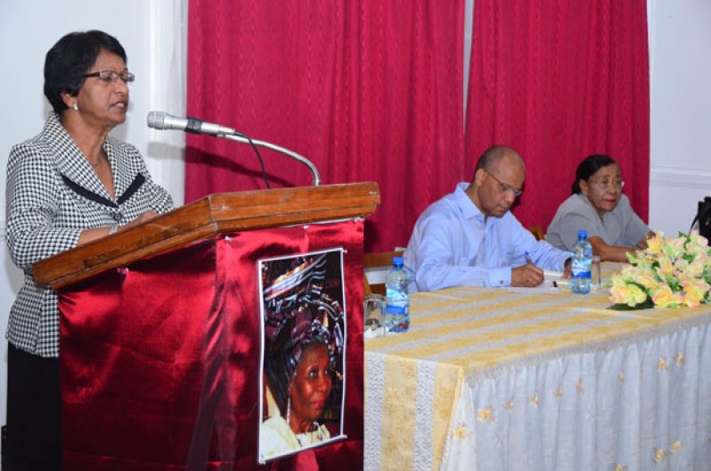 Mrs. Indra Chandrapal addressing the gathering at the Evening of Tributes to the late Jessica Huntley, held at the Cheddi Jagan Research Centre (Red House). Seated at head table are Mr. Clement Rohee and Ms. Philomena Sahoye Shury