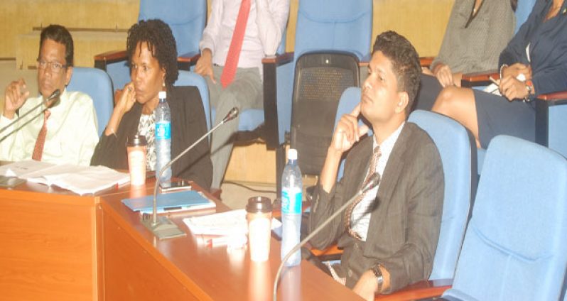 Director of Institute of Health Sciences Education, Dr. Madan Rambaran, at left, with other doctors at the conference, at centre is Dr. Alexandra Harry and at right is Dr. Rabindra Nauth Rambaran