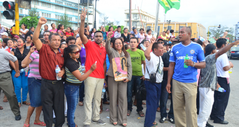 Amerindian residents from communities all across Guyana on the streets of Georgetown yesterday in protest of the opposition’s budgetary cuts. With them at centre is Minister of Amerindian Affairs, Ms Pauline Sukhai (Photo by Adrian Narine)