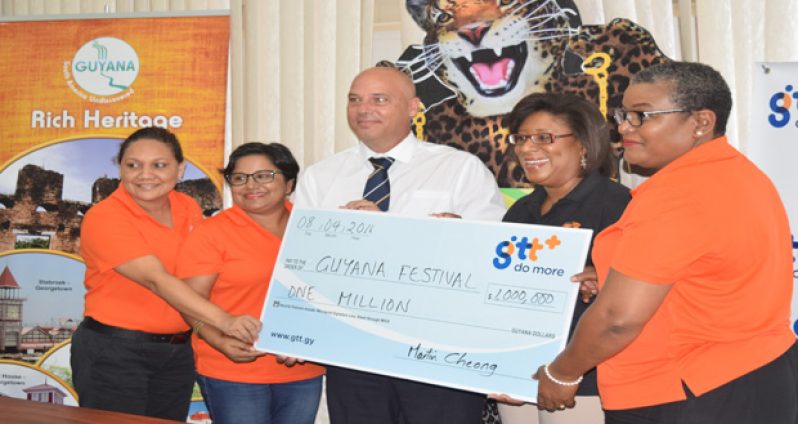 GTT’s Marketing Director Daniel Jilesen (third from left) presenting a ceremonial cheque to Minister Cathy Hughes (second from right), while at extreme right is GTT’s Allison Parker