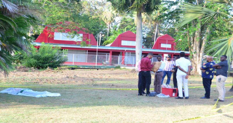 Investigators at the scene of the discovery of the body
