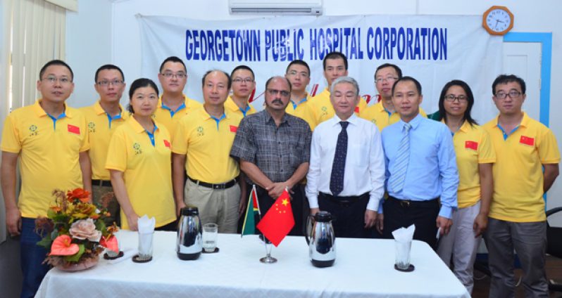 Health Minister Dr. Bheri Ramsaran poses with Chinese Ambassador Zhang Limin and members of the 11th medical brigade