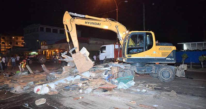 An excavator clearing the area Wednesday evening