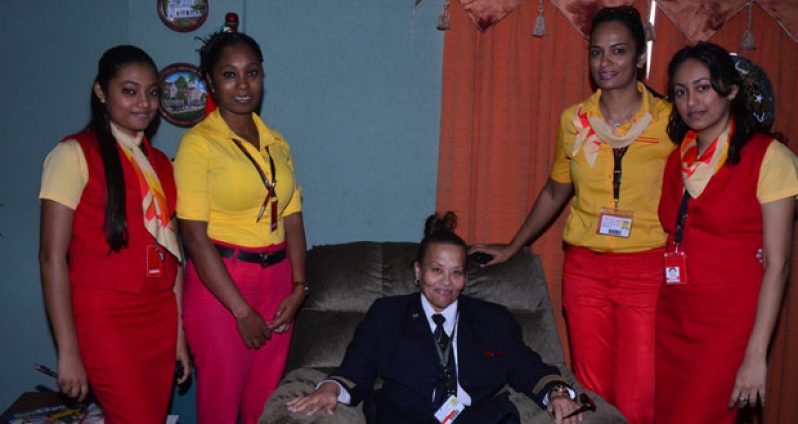 Captain Astrid Deira (centre seated) surrounded by Surinam Airways staff (Adrian Narine photo)