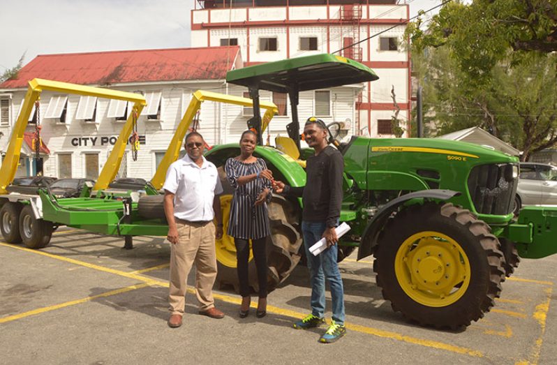 GENEQUIP’s Sales Manager Mohamed Ally (first, left) hands over the equipment to Acting Town Clerk Sharon Harry and Solid Waste Director Walter Narine
