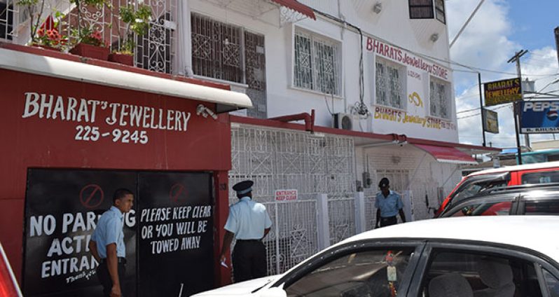 Police investigators at the crime scene yesterday