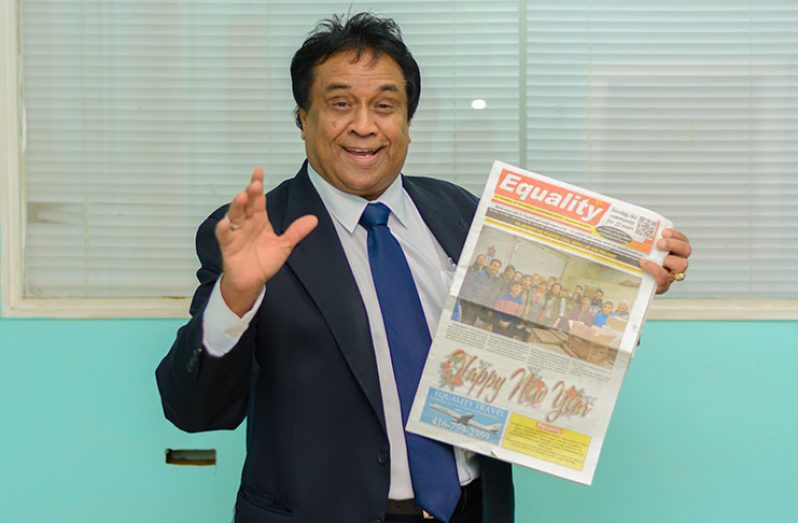 Mr. Bkaskar Sharma, Publisher and Editor-in-Chief of Equality News, displays a copy of his newspaper, Equality