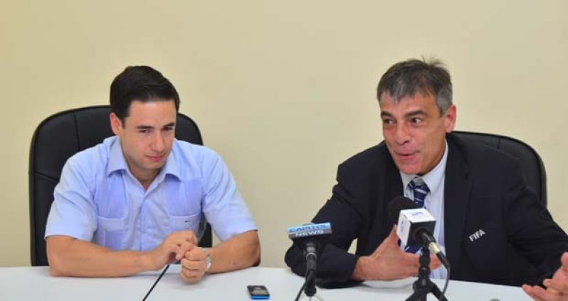 FIFA Head of Member Associations, Premo Cavaro, (right) and CONCACAF’s Director of Legal Affairs Marco Leal address the media at the Pegasus Hotel yesterday on their new plans for the Guyana Football Federation.