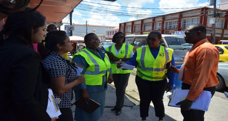 Minister in the Ministry of Social Protection, Simona Broomes and officials of the Labour Department conducted inspections of
businesses along Regent Street on Tuesday (Delano Williams photo)