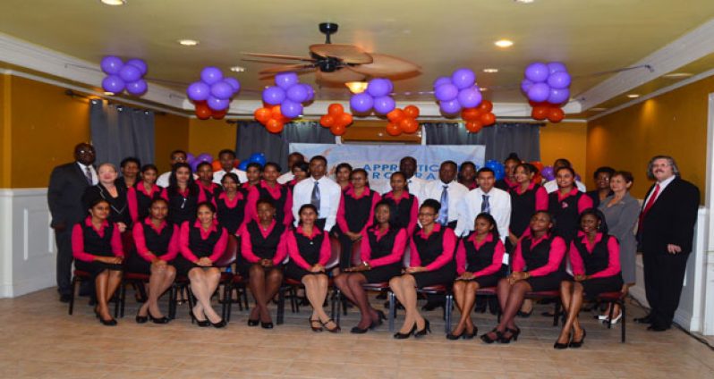 The batch of young apprentices gathers for a group photo taken with officials of the Republic Bank.