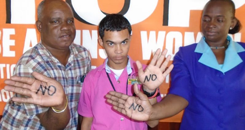 Staffers of the Guyana Chronicle express their support for International Day for the Elimination of Violence against Women 2014