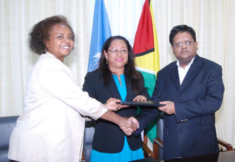 UNDP Representative Khadija Musa, Amerindian Affairs Minister Pauline Sukhai and Finance Minister Dr. Ashni Singh at the signing of the agreement yesterday.