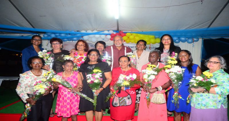 President Donald Ramotar and PPP/C Prime Ministerial candidate, Elisabeth Harper with some of the recognised women at last night’s event at State House (Photos by Adrian Narine)