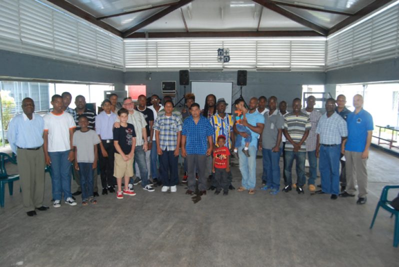 Fathers and sons who attended the “Like Father Like Son” programme yesterday pose with the facilitators