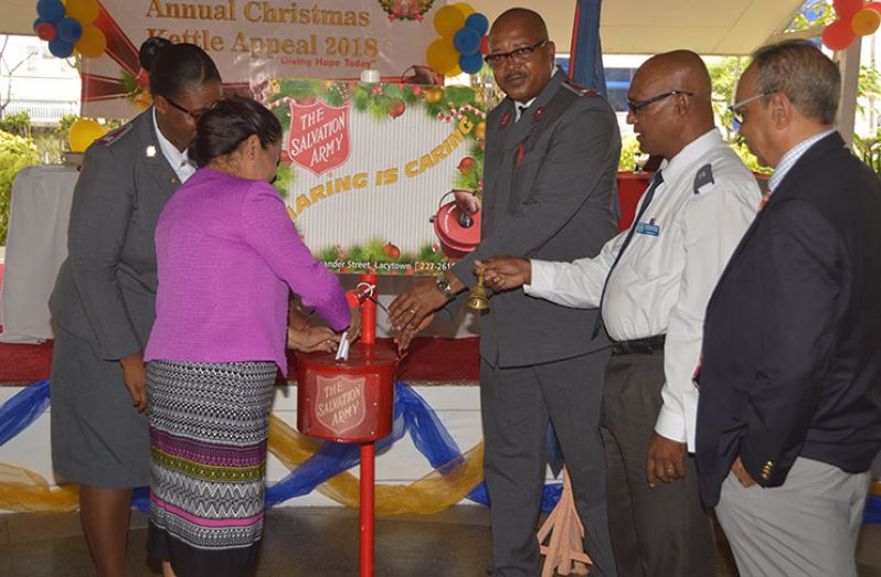 Minister of Public Affairs, Dawn Hastings starts off the contributions for this year Christmas Kettle appeal by the Salvation Army
