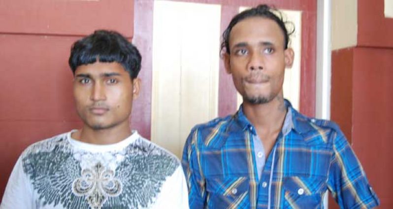 From left to right are the two cousins  Asraf Ali and Abdul Razack who have been  charged with the murder of the 17-year-old Lusignan taxi driver.