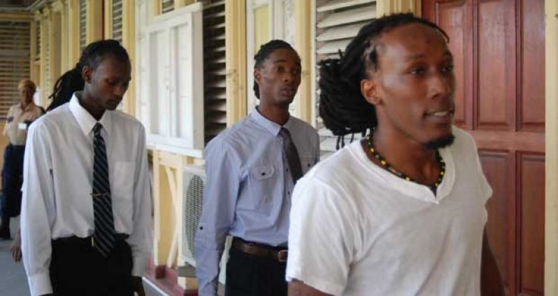 The three accused in the ‘Mango Man’ murder case. Mark Williams, known as Roydon Durant, called ‘Smallie’ (in front) sacked the assigned lawyer and complained that he would not get a fair trial before Judge Navindra Singh and the present prosecutor
Co-defendants Sherwin Nero, called ‘Cuffy’ and Andrew Philander, called ‘Junior’ and ‘Gadget’ in background