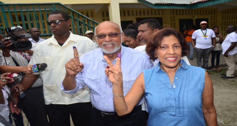 President Donald Ramotar and First Lady Deolatchmee Ramotar display electoral ink (Adrian Narine photo)