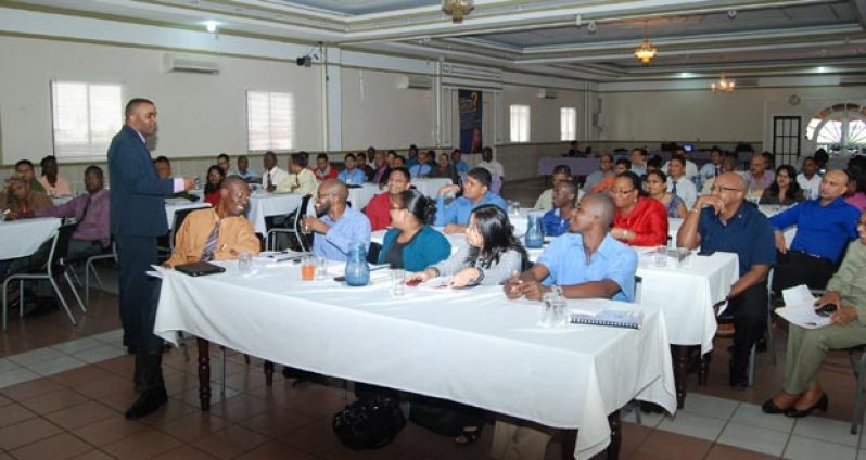 Participants of the IT Auditing Seminar at Regency Suites. being coached by Instructor, Sean Hoyte.