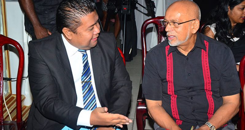 Guyana’s President Donald Ramotar and head of the Surinamese delegation to the Summit, Trade Minister, Mr Don Tosendjojo, engage each other at last evening’s reception at the do at the Princess Hotel (Photo by Adrian Narine)