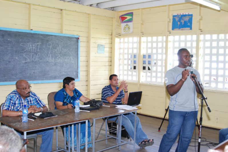 From left are Minister of Local Government and Regional Development, Mr. Norman Whittaker; Acting Town Clerk of Georgetown, Ms. Carol Sooba; and Permanent Secretary of the Ministry of Local Government and Regional Development, Mr. Collin Croal. They are with Municipal Services Officer of the Local Government Ministry, Mr. Fabian Jerrick (addressing the crowd).