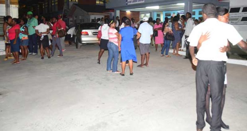 Several employees, relatives and other concerned persons turned up at the GPHC last night (Adrian Narine photo)