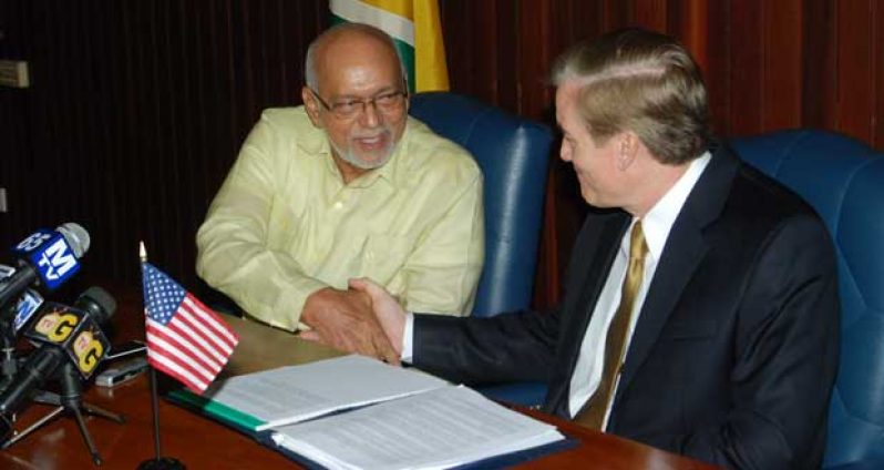 President Donald Ramotar with outgoing US Ambassador, Dr. Brent Hardt (Photo by Cullen Bess-Nelson)