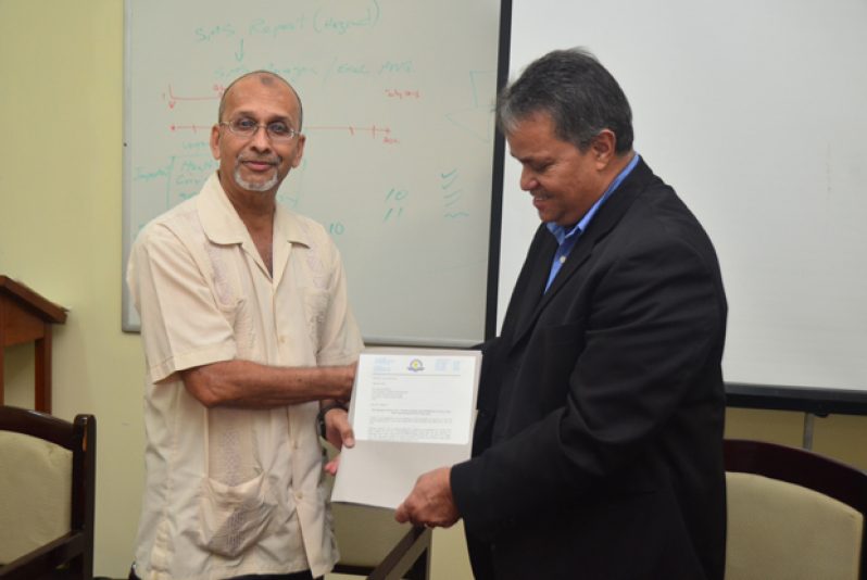 Handing over of the official operations document by Director General of GCAA, Zulficar Mohamed, to Chief Executive Officer of Roraima Airways, Captain Gerald Gouveia