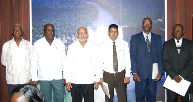 President Donald Ramotar with the members of the Police Service Commission after they were sworn in yesterday. From left are Harold Martin, Carvil Duncan, President Ramotar, Chairman Omesh Satyanand, Lloyd Smith and Keith John (Cullen Bess Nelson photo)