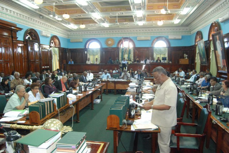 Prime Minister, Mr. Samuel Hinds reading the CFATF statement to the House on Thursday