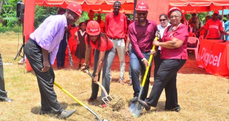 Digicel Guyana Head of Marketing, Jacqueline James and Ministry of Education Coordinator in Charge of Special Needs, Evelyn Hamilton, turn the sod yesterday for the construction of the Linden Rehabilitation Centre for Children, while Region 10 Chairman, Sharma Solomon and IMC Chairman, Orin Gordon and Digicel staffers look on