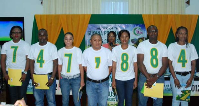 Volunteers show Guyana’s population recorded on Census Day, September 15, 2012