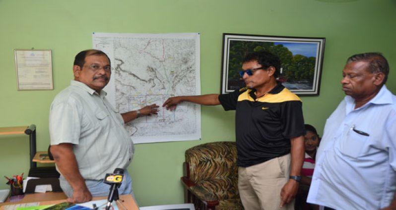 Frank Singh, Cecil Persaud and Tony Melville explaining phase one of the search