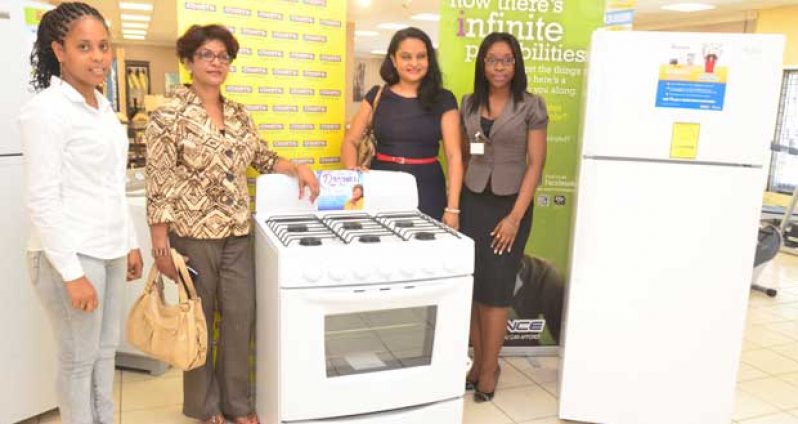 Handing over of the items from Courts Guyana to the Hindu Dharmic Sabha. (L-R) Trudy Abrahams, Marketing Officer of Courts; Representing Baal Nivas & Dharmic Sabha, Dr. Vindhya Persaud, head of the Dharmic Sabha; and Roberta Ferguson, another Marketing Officer of Courts.