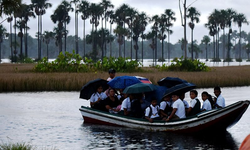 Students as they arrived from Mashabo Village via the boat at the landing on their way to Aurora Secondary School on the Essequibo Coast (Carl Croker photos)