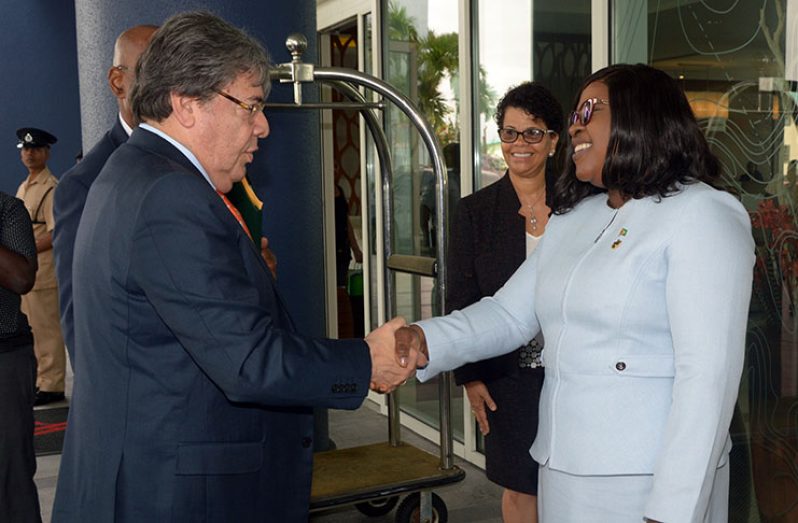 Foreign Affairs Minister, Dr. Karen Cummings welcoming her Colombian counterpart, Carlos Holmes Trujillo Garcia, on Thursday (Adrian Narine photo)