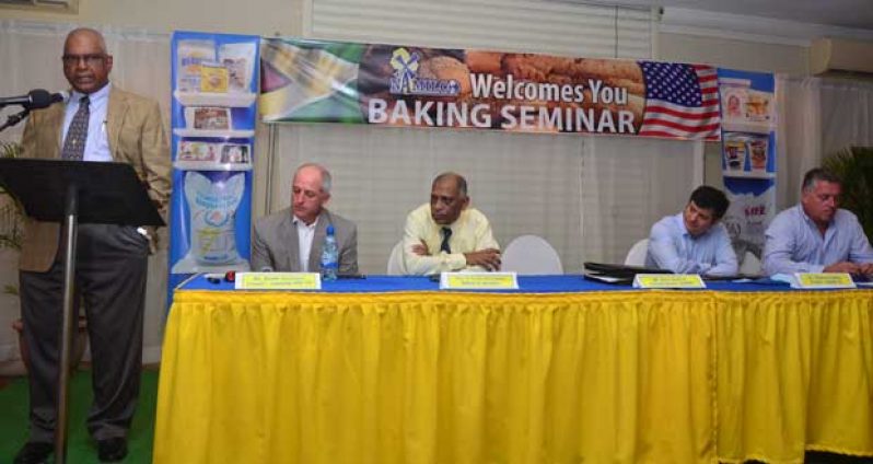 NAMILCO’s Managing Director, Mr. Roopnarine (Bert) Sukhai at the opening of a company-led Baker’s Seminar recently.  Seated from left are: Mr. Keith  Clemens; Dr. Leslie Ramsammy; Mr. Miguel Galdos, and Mr. Ralf Hemsingh of Namilco (Photo by Adrian Narine)