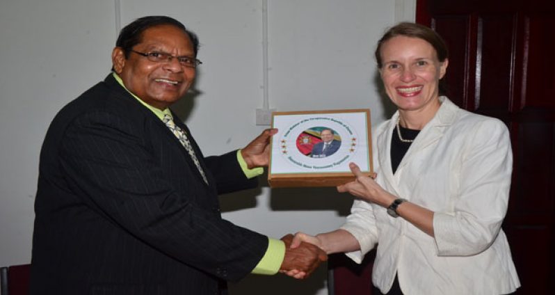 Prime Minister Moses Nagamootoo presents Canadian High Commissioner Dr. Nicole Giles with a token of appreciation (Photo by Adrian Narine)