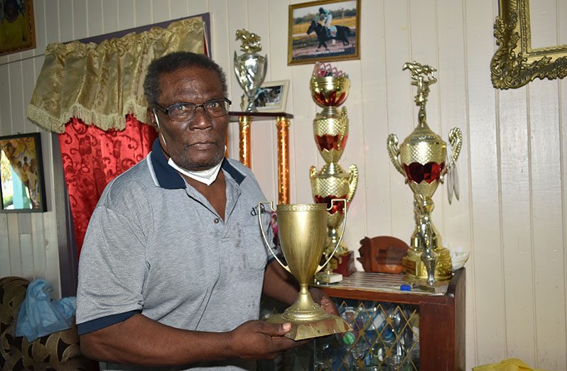 Randolph Mitchell poses with his many trophies (Carl Croker photos)