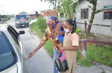 Latifan and her grand-daughter on their way to school