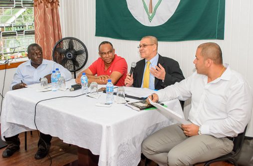 GRA Commissioner- General, Godfrey Statia, makes a point at the meeting on Tuesday afternoon as officials of the GGDMA look on.
