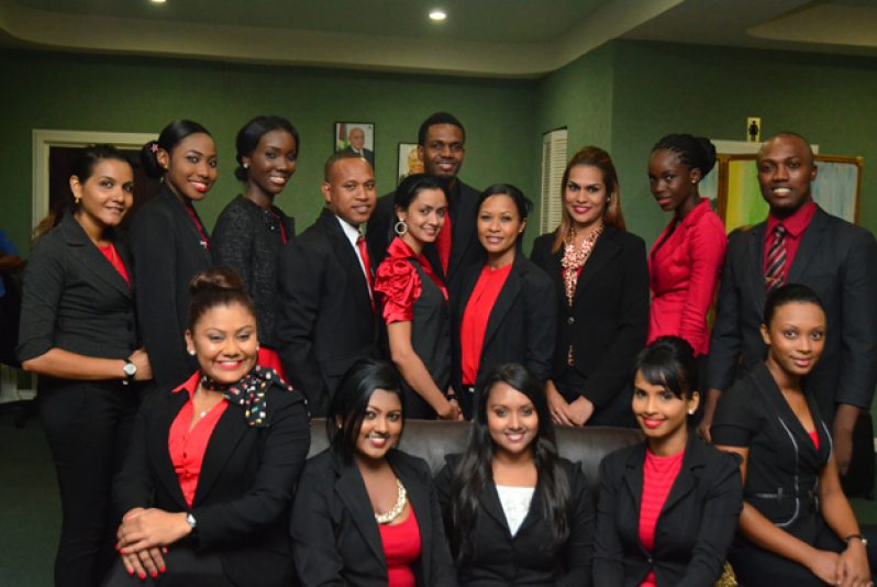 Vanita Jagnarain, General Manager of TravelSpan Guyana (sitting centre) surrounded by the fourteen Guyanese flight attendants (Vishwanauth Narine photo)