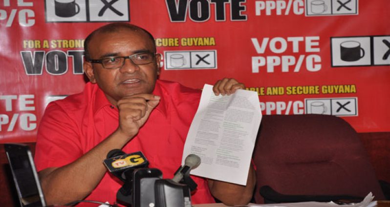 ‘EMPTY PROMISES’: Former president, Dr. Bharrat Jagdeo as he tore APNU+AFC Manifesto to shreds at yesterday’s press conference (Photo by Delano Williams)