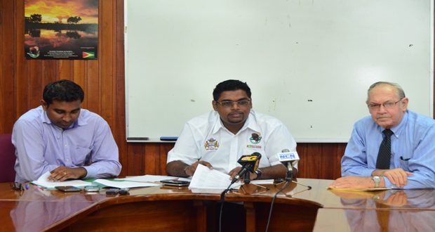 from left Deputy Permanent Secretary, Dhaneshwar Deonarine, Minister Irfaan Ali and Private Sector Commission Chairman, Mr Ronald Webster