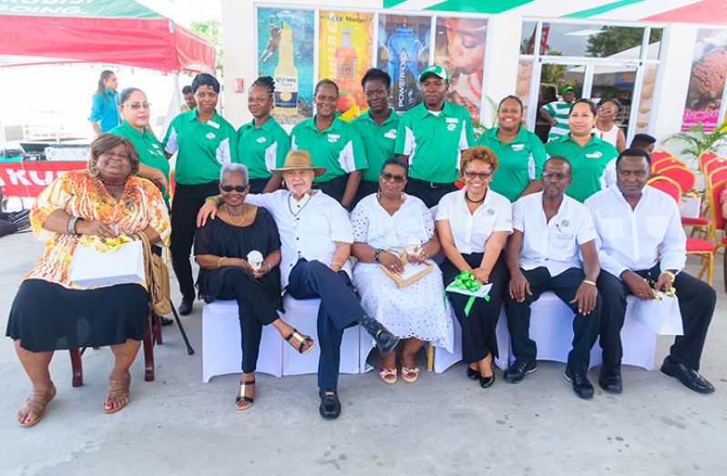 Management and Staff of Ross Rubis Service Station at the commissioning of the service.  Proprietors Mr. and Mrs Coglan and Alice Ross (second and third (front right).  Third and fourth from right - their children: Caretta Ross Hopkinson and Robert Callendar and at extreme right is Caretta’s husband, Sean Hopkinson.